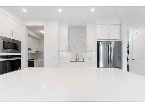 273 Ambleside Avenue Nw, Calgary, AB - Indoor Photo Showing Kitchen With Stainless Steel Kitchen