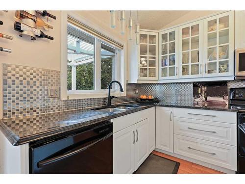 1711 Meadowlark Road Se, Airdrie, AB - Indoor Photo Showing Kitchen With Double Sink