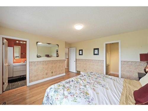 1711 Meadowlark Road Se, Airdrie, AB - Indoor Photo Showing Bedroom