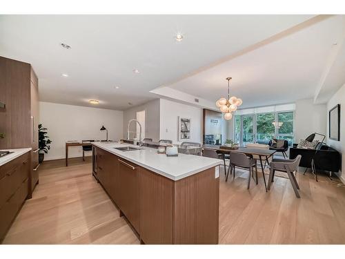 201-128 Waterfront Court Sw, Calgary, AB - Indoor Photo Showing Kitchen