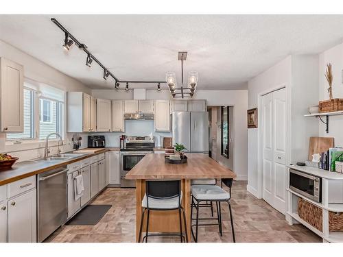 96 Glenhill Drive, Cochrane, AB - Indoor Photo Showing Kitchen With Double Sink