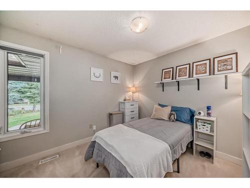 96 Glenhill Drive, Cochrane, AB - Indoor Photo Showing Bedroom