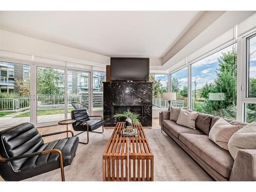 103-128 Waterfront Court Sw, Calgary, AB - Indoor Photo Showing Living Room