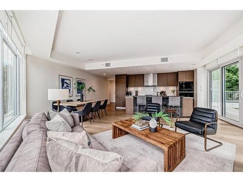 103-128 Waterfront Court Sw, Calgary, AB - Indoor Photo Showing Living Room