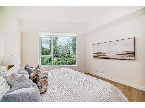 103-128 Waterfront Court Sw, Calgary, AB - Indoor Photo Showing Bedroom