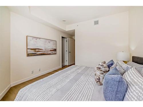 103-128 Waterfront Court Sw, Calgary, AB - Indoor Photo Showing Bedroom