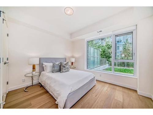 103-128 Waterfront Court Sw, Calgary, AB - Indoor Photo Showing Bedroom