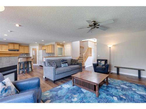 130 Edgeridge Circle Nw, Calgary, AB - Indoor Photo Showing Living Room With Fireplace