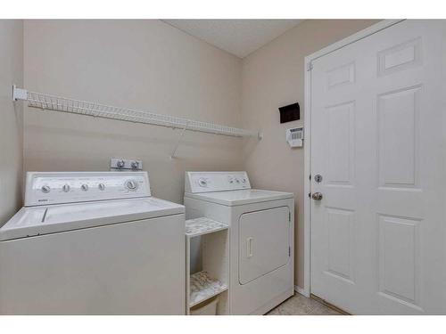 130 Edgeridge Circle Nw, Calgary, AB - Indoor Photo Showing Laundry Room