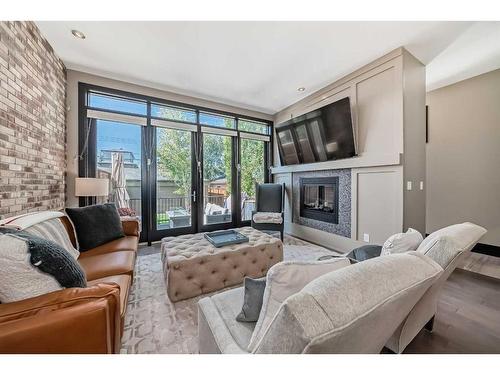 2229 30 Street Sw, Calgary, AB - Indoor Photo Showing Living Room With Fireplace