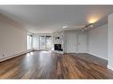 303-350 4 Avenue Ne, Calgary, AB  - Indoor Photo Showing Living Room With Fireplace 