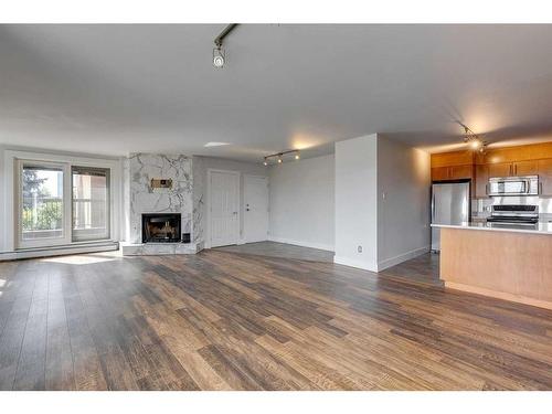 303-350 4 Avenue Ne, Calgary, AB - Indoor With Fireplace