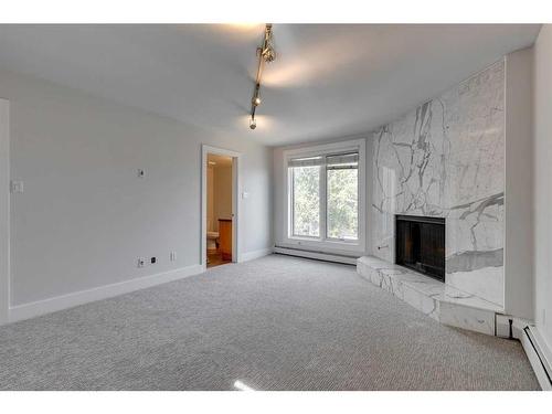 303-350 4 Avenue Ne, Calgary, AB - Indoor With Fireplace