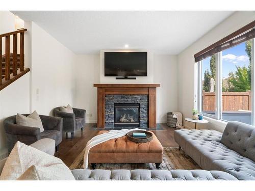 128 Elgin Estates Park Se, Calgary, AB - Indoor Photo Showing Living Room With Fireplace