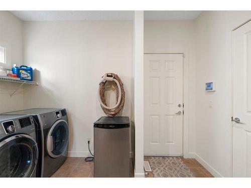 128 Elgin Estates Park Se, Calgary, AB - Indoor Photo Showing Laundry Room