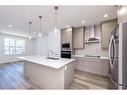 212 Lucas Common Nw, Calgary, AB  - Indoor Photo Showing Kitchen With Double Sink With Upgraded Kitchen 