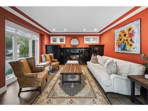 7029 Strathridge Gate Sw, Calgary, AB - Indoor Photo Showing Living Room With Fireplace