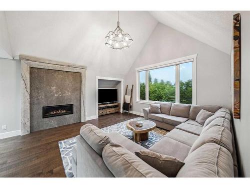 7029 Strathridge Gate Sw, Calgary, AB - Indoor Photo Showing Living Room With Fireplace