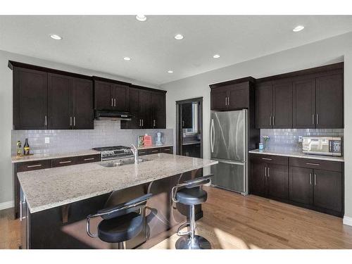 7 Evansborough View Nw, Calgary, AB - Indoor Photo Showing Kitchen With Stainless Steel Kitchen With Double Sink With Upgraded Kitchen