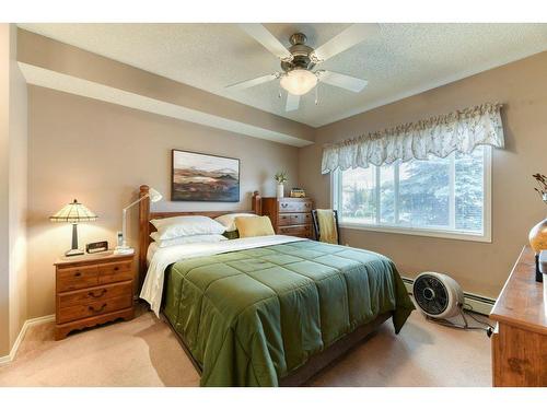 201-390 Marina Drive, Chestermere, AB - Indoor Photo Showing Bedroom