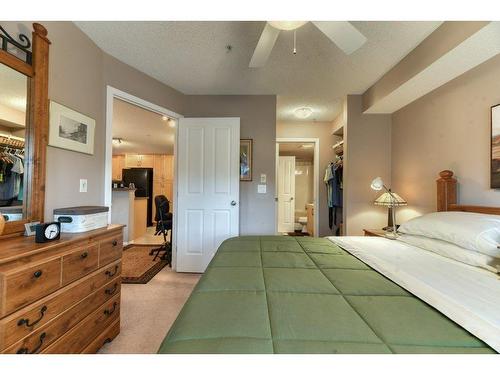 201-390 Marina Drive, Chestermere, AB - Indoor Photo Showing Bedroom