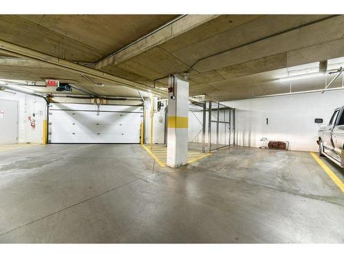 201-390 Marina Drive, Chestermere, AB - Indoor Photo Showing Garage