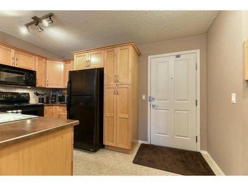 201-390 Marina Drive, Chestermere, AB - Indoor Photo Showing Kitchen