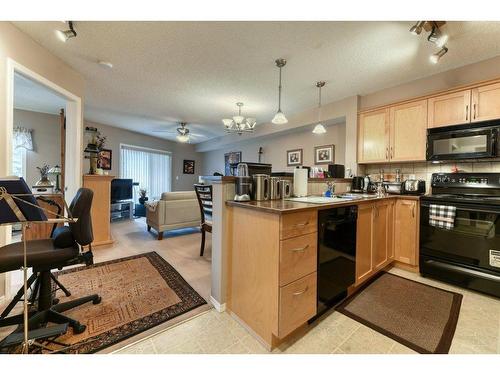 201-390 Marina Drive, Chestermere, AB - Indoor Photo Showing Kitchen