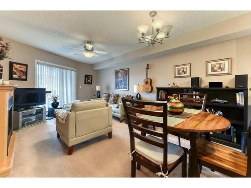 201-390 Marina Drive, Chestermere, AB - Indoor With Fireplace