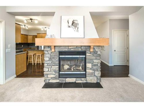 96 Aspen Hills Close Sw, Calgary, AB - Indoor Photo Showing Living Room With Fireplace