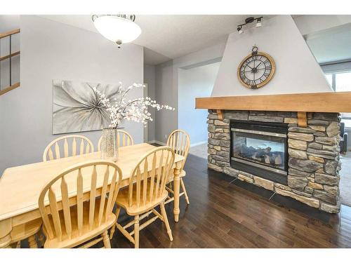 96 Aspen Hills Close Sw, Calgary, AB - Indoor Photo Showing Other Room With Fireplace