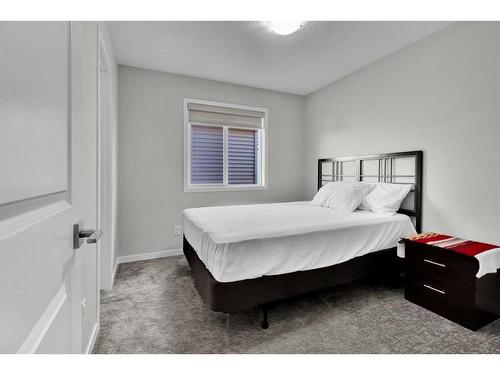 261 Creekside Boulevard Sw, Calgary, AB - Indoor Photo Showing Bedroom