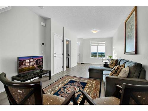 261 Creekside Boulevard Sw, Calgary, AB - Indoor Photo Showing Living Room