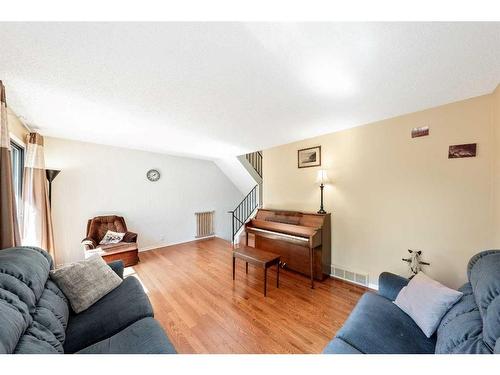 307 Woodvale Crescent Sw, Calgary, AB - Indoor Photo Showing Living Room