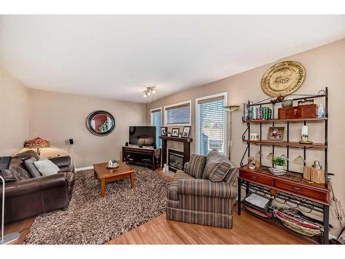 3-102 Canoe Square Sw, Airdrie, AB - Indoor Photo Showing Living Room