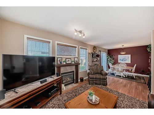 3-102 Canoe Square Sw, Airdrie, AB - Indoor Photo Showing Living Room With Fireplace