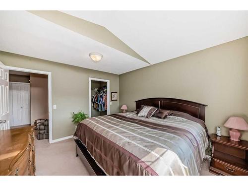 3-102 Canoe Square Sw, Airdrie, AB - Indoor Photo Showing Bedroom