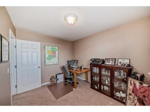 3-102 Canoe Square Sw, Airdrie, AB - Indoor Photo Showing Office