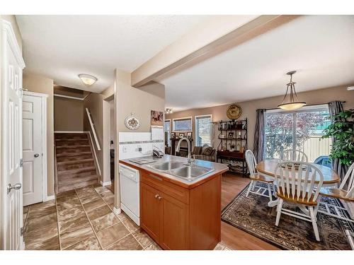 3-102 Canoe Square Sw, Airdrie, AB - Indoor Photo Showing Kitchen With Double Sink