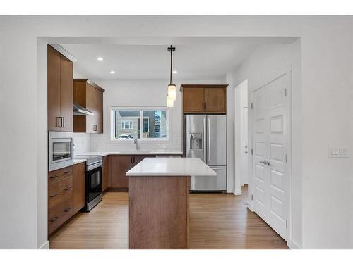 301 Bayview Street Sw, Airdrie, AB - Indoor Photo Showing Kitchen With Upgraded Kitchen