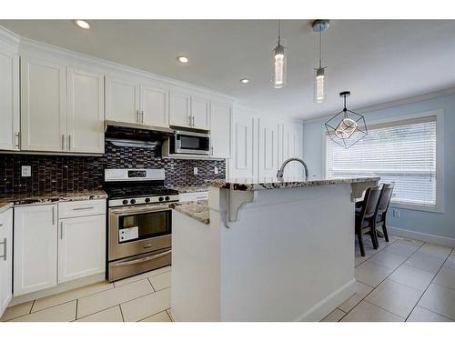 1699 Baywater Park, Airdrie, AB - Indoor Photo Showing Kitchen With Upgraded Kitchen