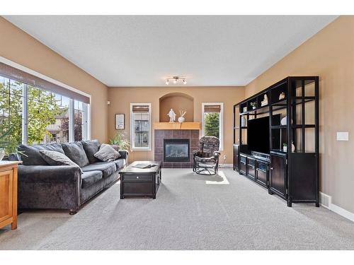 2002 High Country Rise Nw, High River, AB - Indoor Photo Showing Living Room With Fireplace