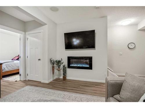 551 Mahogany Boulevard Se, Calgary, AB - Indoor With Fireplace