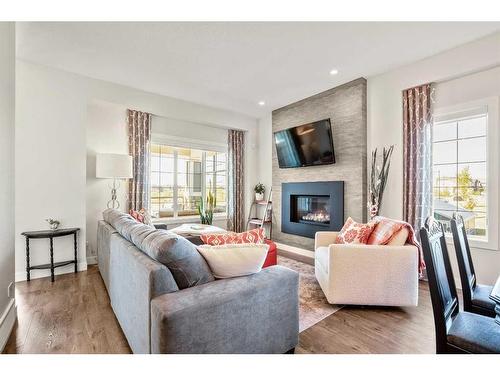 551 Mahogany Boulevard Se, Calgary, AB - Indoor Photo Showing Living Room With Fireplace