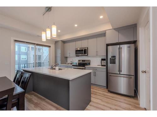 577 Canal Crossing Sw, Airdrie, AB - Indoor Photo Showing Kitchen With Double Sink