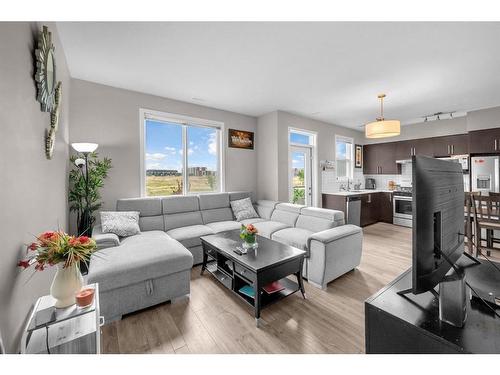 202-415 Redstone Walk Ne, Calgary, AB - Indoor Photo Showing Living Room