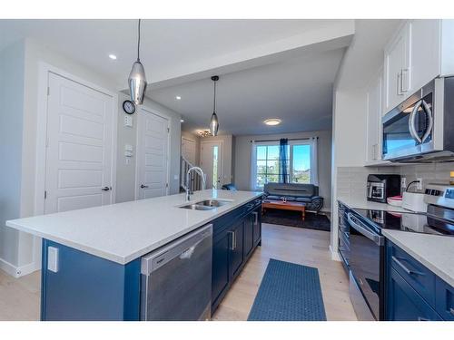 1187 Lanark Boulevard Se, Airdrie, AB - Indoor Photo Showing Kitchen With Double Sink With Upgraded Kitchen