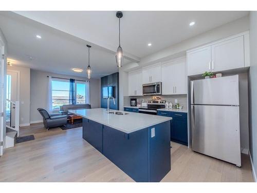 1187 Lanark Boulevard Se, Airdrie, AB - Indoor Photo Showing Kitchen With Stainless Steel Kitchen With Upgraded Kitchen