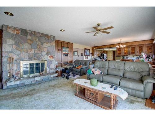 20015 Township Road 264, Rural Rocky View County, AB - Indoor Photo Showing Living Room With Fireplace