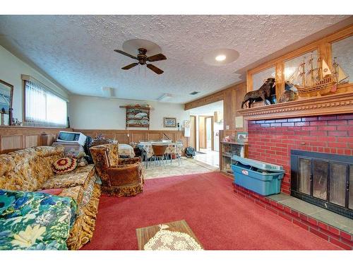 20015 Township Road 264, Rural Rocky View County, AB - Indoor Photo Showing Living Room With Fireplace